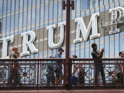 CHICAGO, IL - JUNE 12: Workers install the final letter for a giant TRUMP sign on the outside of the Trump Tower on June 12, 2014 in Chicago, Illinois. Many in the city are opposed to the sign including Mayor Rahm Emanuel who has called it tacky and tasteless. (Photo …
