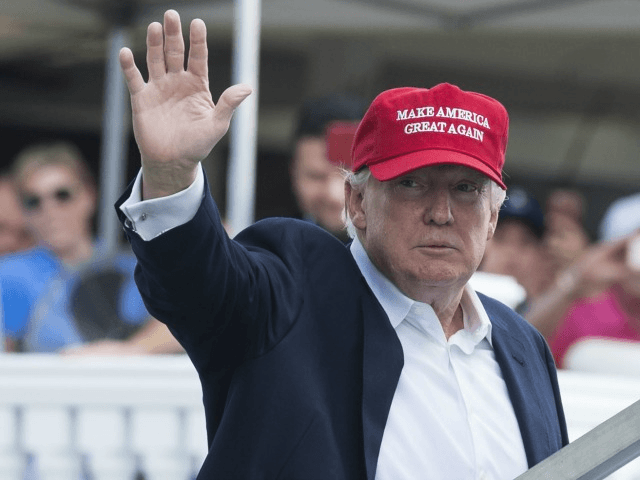 US President Donald Trump waves to well wishers as he arrives at the 72nd US Women's Open Golf Championship at Trump National Golf Course in Bedminster, New Jersey