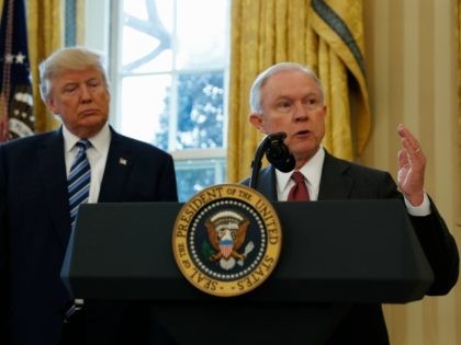 President Donald Trump listens as Attorney General Jeff Sessions speaks in the Oval Office