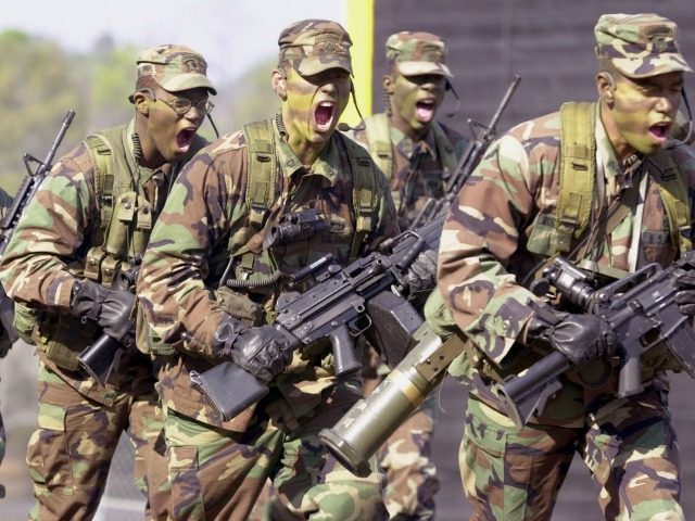 A U.S. Army Ranger unit goes through its paces during a demonstration of the elite force November 9, 2001 before a graduation ceremony at Fort Benning in Columbus, Georgia. Rangers have been used in the military actions in Afghanistan. (Photo by Erik S. Lesser/Getty Images)