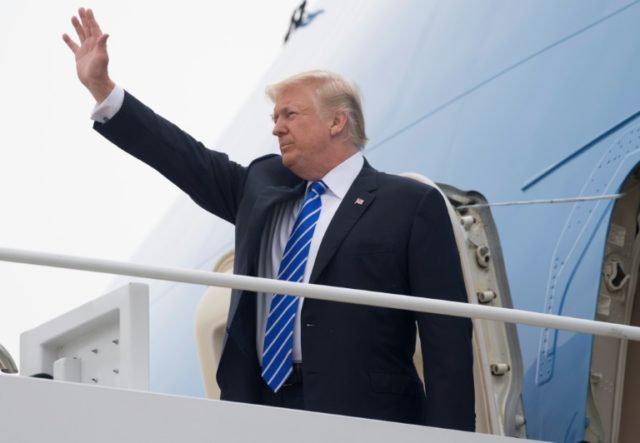 US President Donald Trump boards Air Force One prior to departure from Andrews Air Force B