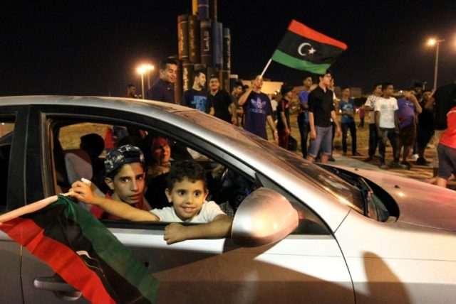 Libyans celebrate in Benghazi after strongman Khalifa Haftar late on July 5, 2017 announce