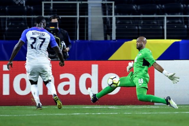 United States's forward Jozy Altidore scores against Costa Rica's goalkeeper Patrick Pembe