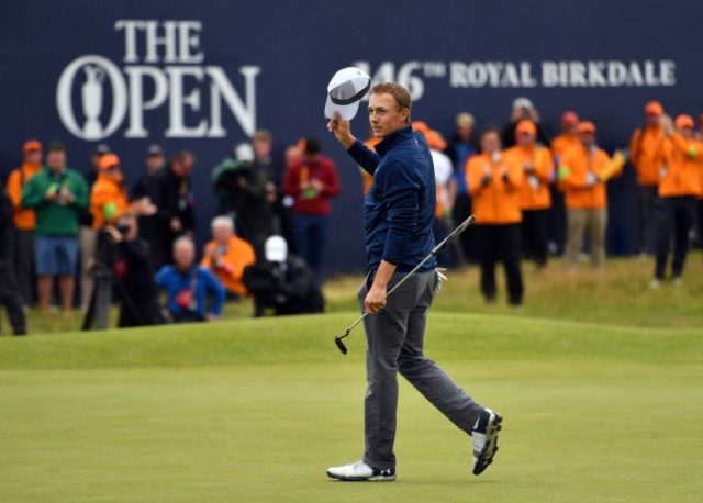 US golfer Jordan Spieth celebrates on the 18th green of the Royal Birkdale golf course on