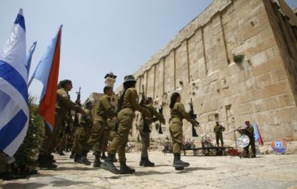 Israeli soldiers stand outside Hebron's Tomb of the Patriarchs, also known as the Ibrahimi Mosque, a holy shrine for Jews and Muslims, on July 12, 2017