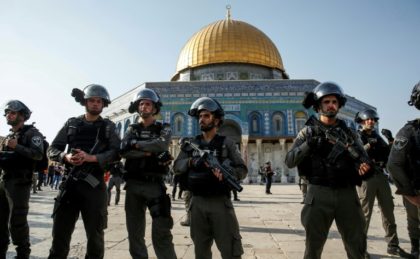 Israeli security forces stand guard in front of the Dome of the Rock in the Haram al-Shari