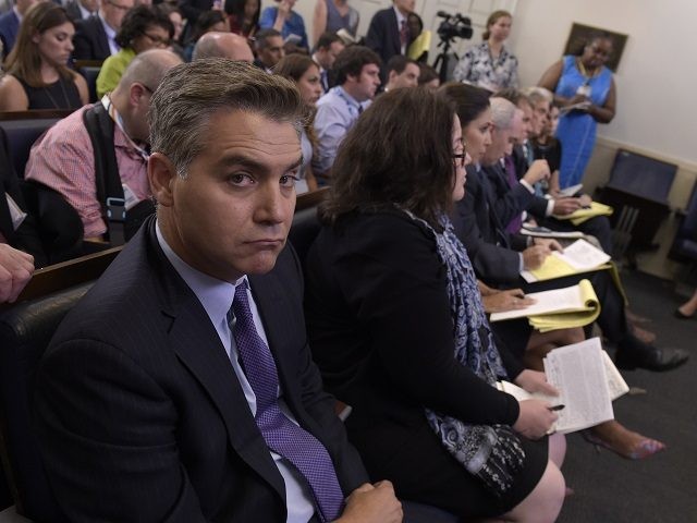 Jim Acosta of CNN listens during the daily briefing at the White House in Washington, Wedn