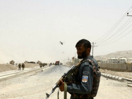 An Afghan policeman stands guard near to the site of a suicide bomber struck at a NATO convoy in Kandahar southern of Kabul, Afghanistan, Wednesday, Aug. 2, 2017. A suicide bomber struck a NATO convoy near the southern Afghan city of Kandahar on Wednesday, causing casualties, the U.S. military said. …