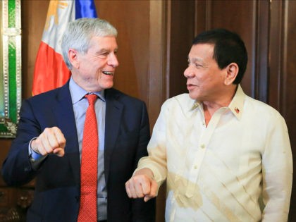 President Rodrigo Roa Duterte does his signature pose along with Australian Secret Intelligence Service Director General Nicolas Peter 'Nick' Warner who paid a courtesy call on the President in Malacañan Palace on August 22, 2017. ALBERT ALCAIN/PRESIDENTIAL PHOTO
