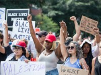 Boston-counter-protesters-free-speech-rally-getty Counter protesters hold up fists and signs during a march to the 'Free Speech Rally' on Boston Common on August 19, 2017 in Boston, Massachusetts. Thousands of demonstrators and counter-protestors are expected at Boston Common where the Boston Free Speech Rally is being held. (Photo by Scott Eisen/Getty Images)