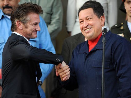 Venezuelan President Hugo Chavez (R) greets US actor Sean Penn (L) after a meeting in Mira