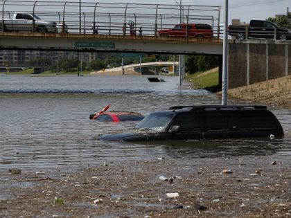 Vehicles are left stranded on Texas State Highway 288 in Houston, Texas on May 26, 2015. Heavy rains throught Texas put the city of Houston under massive amounts of water, closing roadways and trapping residents in their cars and buildings, according to local reports. Rainfall reached up to 11 inches …