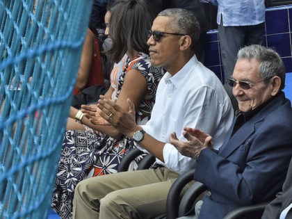 US President Barack Obama and Cuban President Raul Castro (R) applaud during a Major League baseball exhibition game between the Tampa Bay Rays and the Cuban national team at the Latinoamericano stadium in Havana on March 22, 2016. Obama praised the bravery of Cuban dissidents Tuesday in a meeting at …