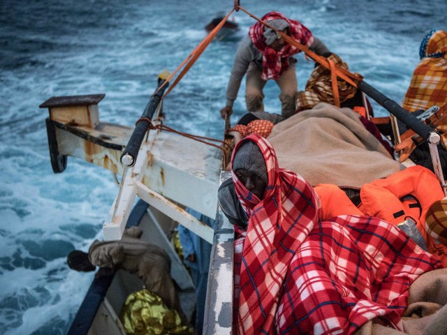 AT SEA, AT SEA - FEBRUARY 19: Refugees and migrants sleep on deck of the Spanish NGO Proac