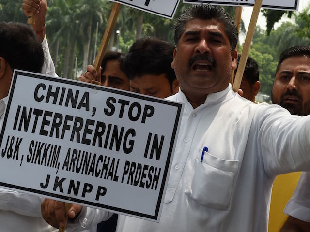 Indian activists of the Jammu and Kashmir National Panthers Party protest outside the Chin