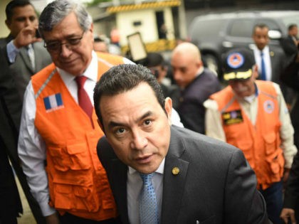 Guatemalan President Jimmy Morales and Vice-President Jafeth Cabrera (L) arrive at the headquarters of Guatemala's National Coordinator for Disaster Reduction (CONRED) in Guatemala City to offer a press conference after a strong earthquake hit the country on June 14, 2017. A strong 6.9 magnitude earthquake hit western Guatemala early on …