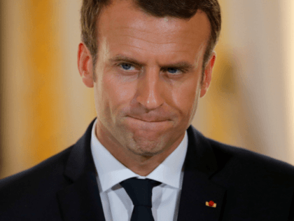 French President Emmanuel Macron reacts during a joint press conference with Israel's