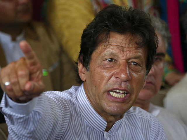 Pakistani opposition leader Imran Khan gestures during a news conference regarding the dis