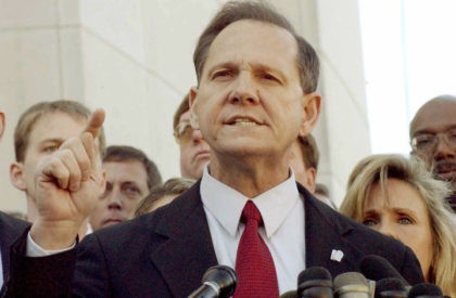 FILE PHOTO: Alabama Chief Justice Roy Moore faces the media after being removed from office in Montgomery, Alabama, U.S. November 13, 2003. REUTERS/Bob Ealum/File Photo