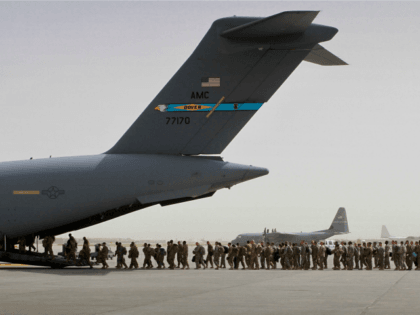 In this Thursday, July 14, 2011 file photo, U.S. soldiers board a U.S. military aircraft as they leave Afghanistan, at the U.S. base in Bagram, north of Kabul, Afghanistan. U.S. A bill passed by Congress allowing the families of 9/11 victims to sue the Saudi government has reinforced to some …