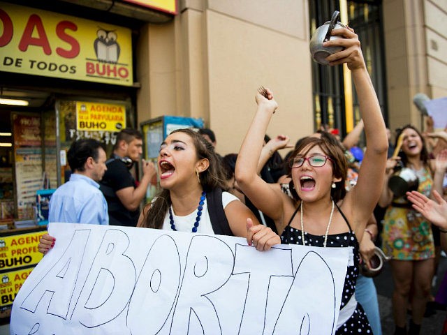 Activists take part in a demo in favor of abortion in Santiago on March 21, 2016. Lawmaker