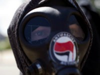 An Antifa demonstrator participates in the Denver March Against Sharia Law in Denver, Colorado on June 10, 2017. The march was supported by two right-wing groups, The Proud Boys, and Bikers Against Radical Islam. Police kept the counter protestors separated during the rally which was held in front of the Colorado State Capital. The march was one of many held throughout the U.S. opposing Sharia law, and was viewed by many as promoting both Islamophobia and racism. / AFP PHOTO / Jason Connolly (Photo credit should read JASON CONNOLLY/AFP/Getty Images)