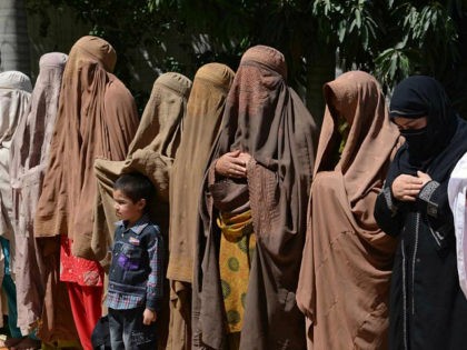 Burqa-clad female supporters of Pakistani Prime Minister-elect and head of the Pakistan Muslim League-N (PML-N) Nawaz Sharif offer special prayers as they observe the "thanks giving day" on the victory of their party in landmark general elections, in Peshawar on May 17, 2013. Partial official results confirm PML-N on 123 …