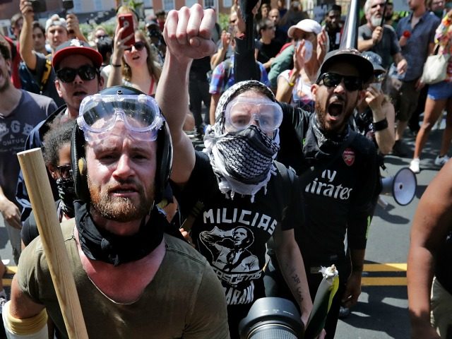 Anti-fascist counter-protesters wait outside Emancipation Park to hurl insults as white na