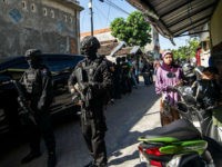 counterterrorism-police-islamic-state-indonesia-getty Members of the Densus 88 counter-terrorism police cordon off a road as they search a house in Surabaya, East Java province, on June 19, 2017, following the arrest of a man suspected of links with the Islamic State (IS) group. The Islamic State (IS) group claimed responsibility for the May …