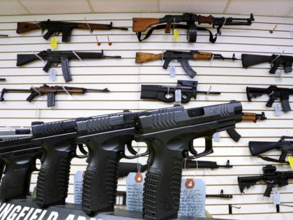 FILE - In this Jan. 16, 2013 file photo, assault weapons and handguns are seen for sale at Capitol City Arms Supply in Springfield, Ill. In a questionnaire for The Associated Press, the four GOP candidates for governor, state Sens. Bill Brady and Kirk Dillard, state Treasurer Dan Rutherford and …