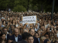 ARGENTINA-JUSTICE-AMIA-NISMAN-VIGIL People hold candles during a vigil on the first anniversary of Argentinian prosecutor Alberto Nisman's mysterious death in Buenos Aires, on January 18, 2016. The prosecutor died in mysterious circumstances in January 18, 2015, after accusing Argentina's then president, Cristina Fernandez de Kirchner, of obstructing his investigation of a 1994 …