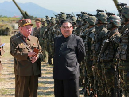 This undated photo released by North Korea's official Korean Central News Agency (KCNA) on August 26, 2017 shows North Korean leader Kim Jong-Un (C) presiding over a target strike exercise conducted by the special operation forces of the Korean People's Army (KPA) at an undisclosed location. North Korea fired three …