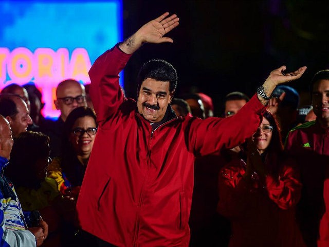 Venezuelan president Nicolas Maduro celebrates the results of 'Constituent Assembly', in Caracas, on July 31, 2017. Deadly violence erupted around the controversial vote, with a candidate to the all-powerful body being elected shot dead and troops firing weapons to clear protesters in Caracas and elsewhere. / AFP PHOTO / RONALDO …