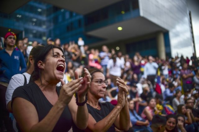 Venezuelans, who protested against President Nicolas Maduro in Caracas on Monday after the