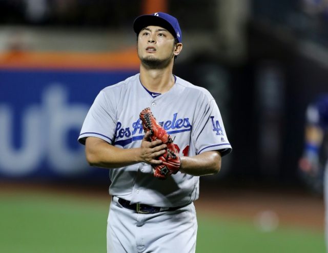 Yu Darvish of the Los Angeles Dodgers celebrates the last out of the seventh inning agains