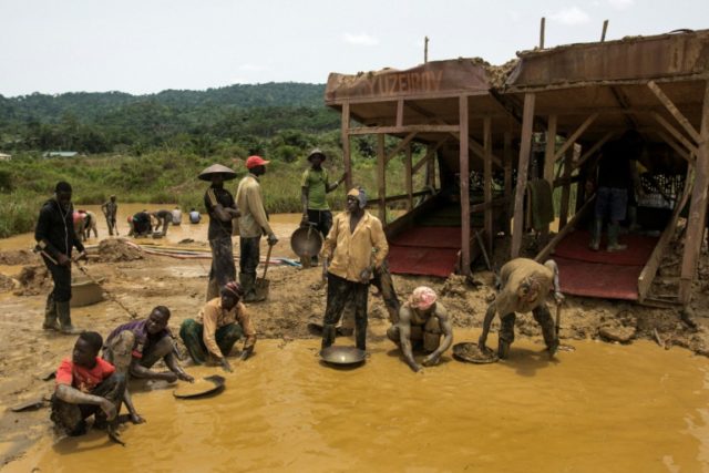 A group of galamseyers, illegal gold panners, working in the Kibi area of Ghana, long know