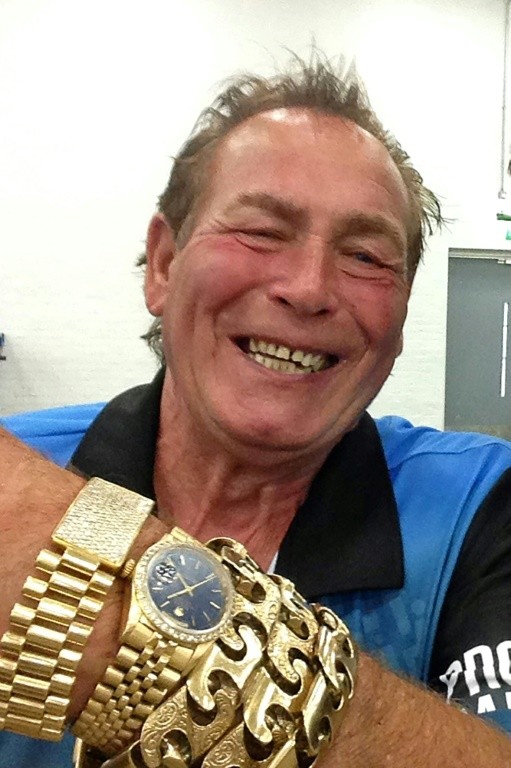 Darts legend Bobby George, showing off jewellery in his flamboyant style, is pro-EU and sl