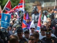 Members of the Ku Klux Klan and others arrive for a rally July 8, 2017, calling for the protection of Southern Confederate monuments, in Charlottesville, Virginia, just a month before the August 11, 2017 "Unite the Right" rally in the same city