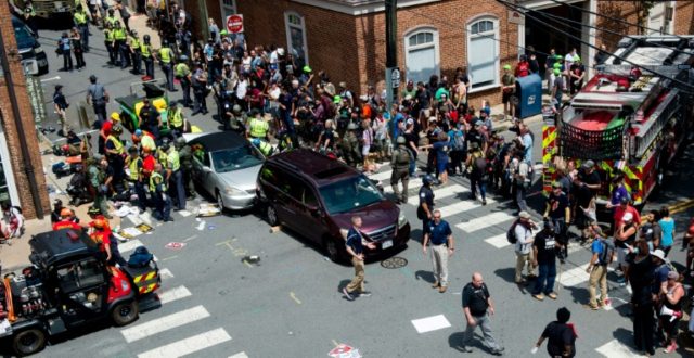 People receive first aid after a car ran into a crowd of protesters in Charlottesville, Vi