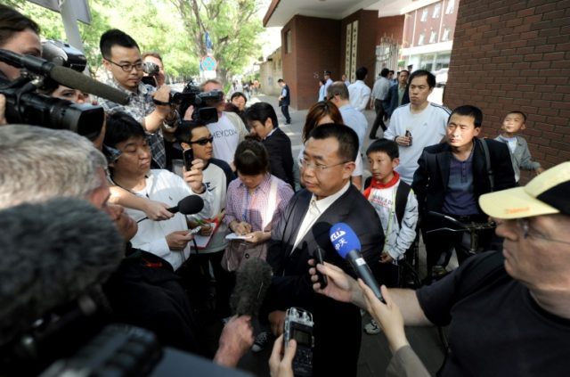 Chinese rights lawyer Jiang Tianyong (C) speaking to foreign media in May 2012 outside the