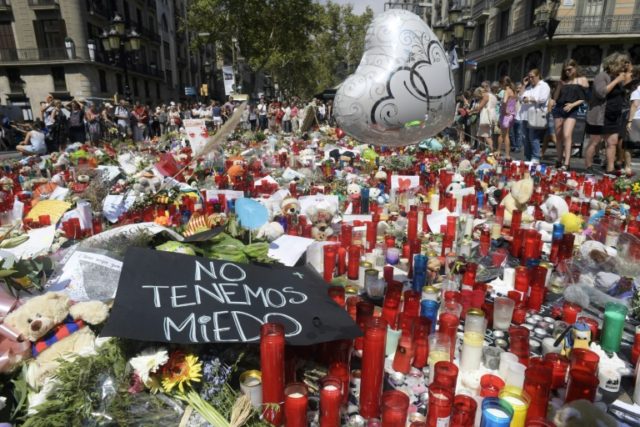 Flowers, candles, balloons have been laid on Las Ramblas in Barcelona in memory of the vic