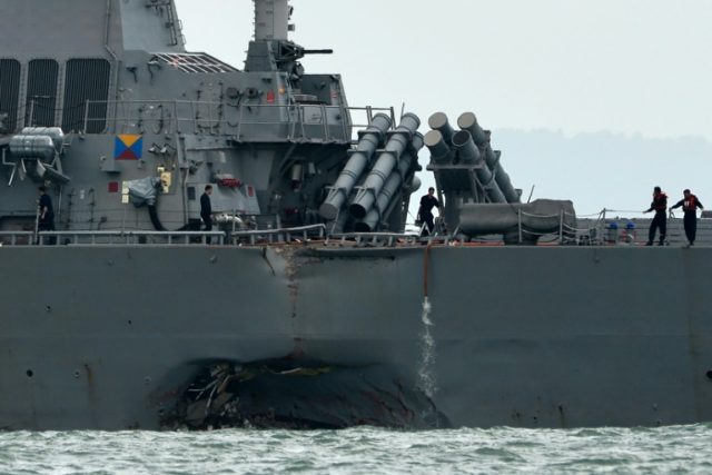 A collision between USS John S. McCain and an oil tanker off Singapore left a huge gash in