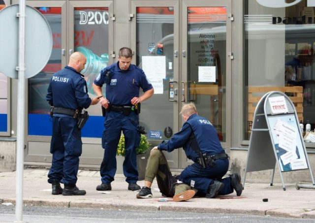 Finnish police detain a suspect who was shot in the leg after several people were stabbed
