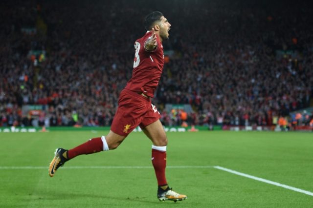 Liverpool's midfielder Emre Can celebrates scoring the team's first goal during the Champi