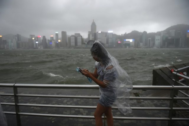 More than 120 were injured in Hong Kong as the territory was lashed with hurricane winds a