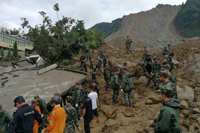 Chinese rescue workers at the scene of the landslide in Guizhou province
