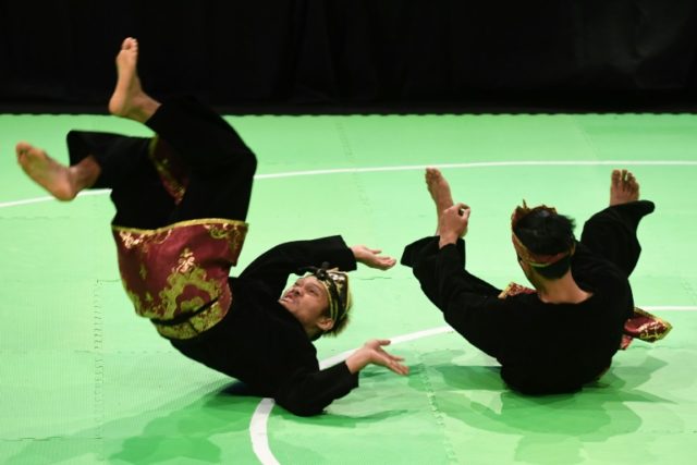 Hendy and Yolla Primadona Jumpil of Indonesia perform during the pencak silat doubles fina