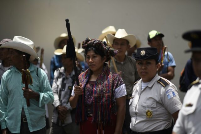 Representatives of different indigenous peoples demonstrate in support of the head of the