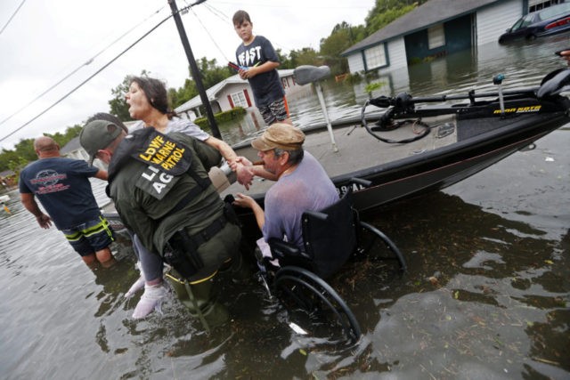 Harvey reporters cast aside role as observers to help Photo The Associated Press