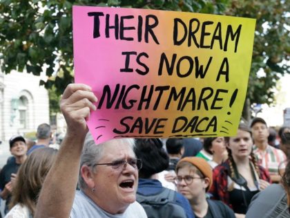 Judy Weatherly, a supporter of the Deferred Action for Childhood Arrivals (DACA), holds up a sign during a protest outside of the Federal Building in San Francisco, Tuesday, Sept. 5, 2017. President Donald Trump on Tuesday began dismantling DACA, the government program protecting hundreds of thousands of young immigrants who …